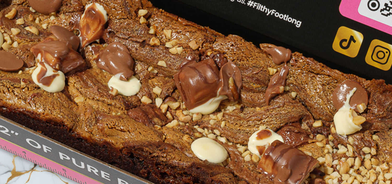 Kinder footlong brownie topped with Kinder chocolate and drizzled sauce, baked fresh and delivered nationwide across the UK